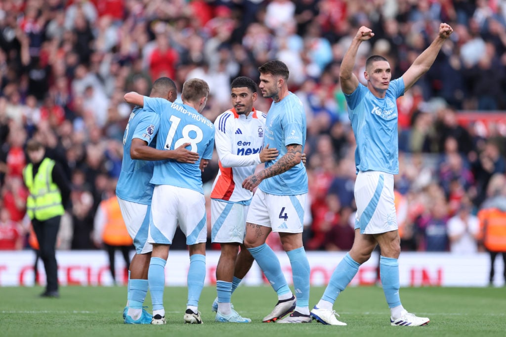 Nottingham Forest player Nikola Milenkovic celebrates with his teammates after the Premier League match between Liverpool FC and Nottingham Forest FC.